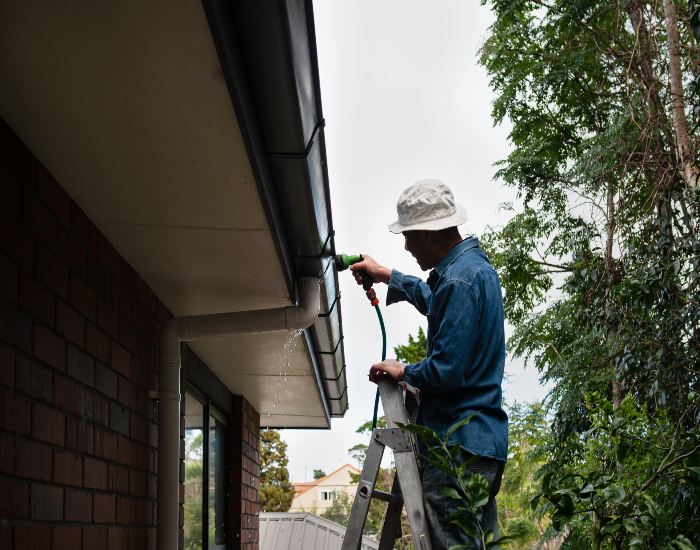 Professional gutter cleaning in progress at A Clear View Window Cleaning in Stewartstown, PA