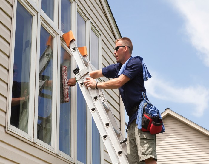 An expert window cleaner from A Clear View Window Cleaning is cleaning windows in Stewartstown, PA